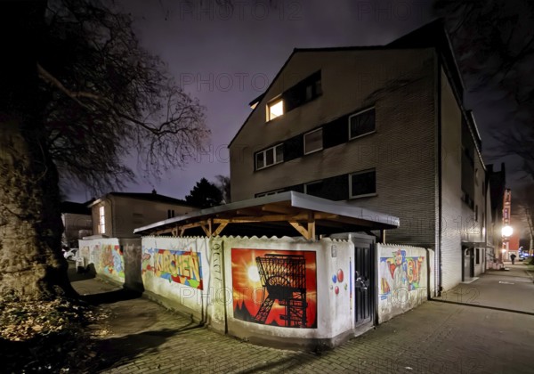 Wall painting in the street Flöz Sunshine at night in one of the poorest cities in Germany, Gelsenkirchen, Ruhr area, North Rhine-Westphalia