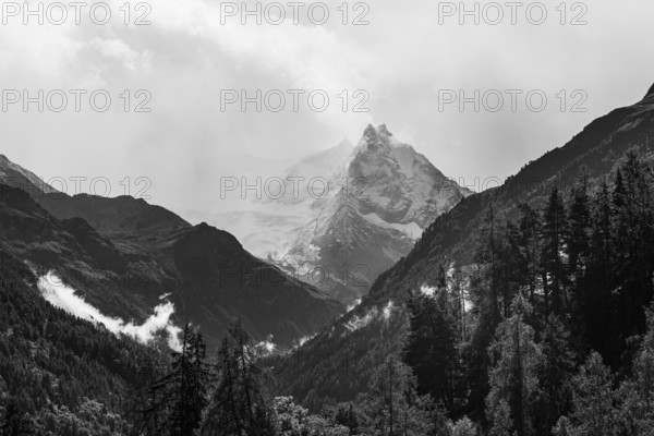 The summit of Mount Besso in fog, near Zinal, black and white photo, Val d'Anniviers, Valais Alps, Canton of Valais, Switzerland