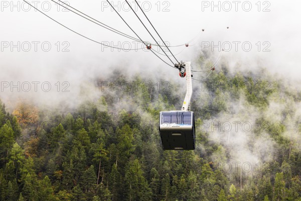 Gondola and cable car line in fog, cable car from Grimentz to the Espace Weisshorn summit station, Val d'Anniviers, Valais Alps, Canton of Valais, Switzerland