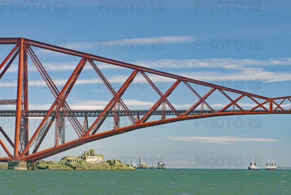A section of a red bridge over a lake with passing boats, railway bridge, Firth of Forth, Edinburgh, Scotland, Great Britain