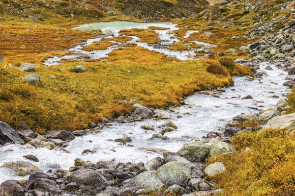 A glacier stream flows from Lac de Chateaupre into the Lac de Moiry reservoir, Val d'Anniviers, Valais Alps, Canton of Valais, Switzerland