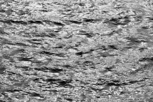 Water surface with waves and light reflections, black and white, Möhnesee, Möhnetalsperre, North Rhine-Westphalia, Germany