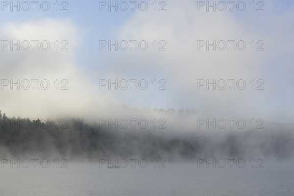 Hennesee, fog, rising clouds of fog, anglers in the boat, blue sky, Hennetalsperre, Sauerland-Rothaargebirge nature park Park, North Rhine-Westphalia, Germany