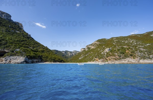 Picturesque rocky coast with Cala Sisine beach, cliffs and blue sea, Golfo di Orosei, Baunei, Sardinia, Italy