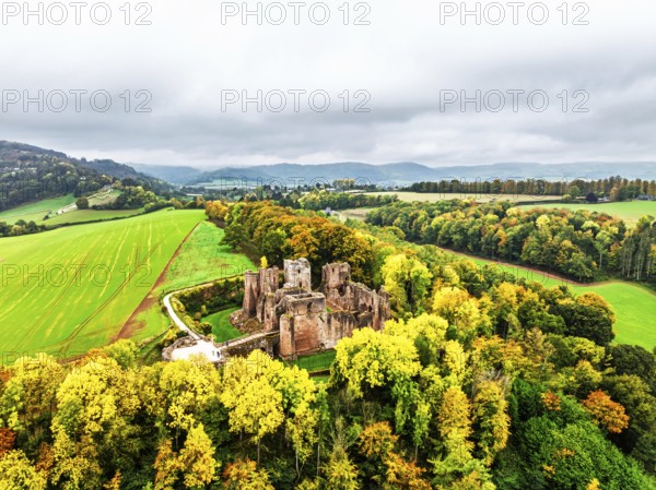 Autumn Colours over ruins of Goodrich Castle and River Wye from a drone, Goodrich, Herefordshire, England, United Kingdom
