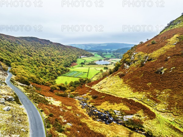 Autumn Colours over Gwynllyn Lake and Stream Nantgwynllyn from a drone, Rhayader, Powys, Radnorshire, Wales, UK