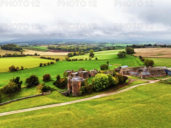 Autumn Colours over ruins of Pembridge Castle or Newland Castle from a drone, Herefordshire, England, United Kingdom
