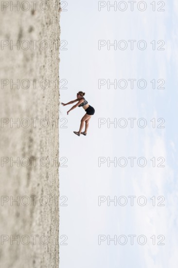 Symbolic picture, abstract, woman falling, rotated image on the Etosha pan, salt pan, Etosha National Park, Namibia