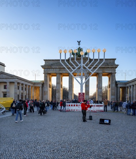 Large Hanukkah chandelier at the Brandenburg Gate in daylight, sign of lively Jewish life, symbolic power for 20 years, Berlin, Germany
