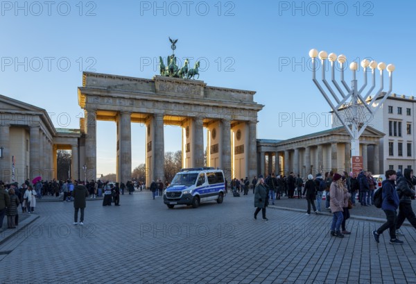 Large Hanukkah chandelier at the Brandenburg Gate in daylight, sign of lively Jewish life, symbolic power for 20 years, Berlin, Germany