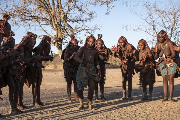 Himba woman dancing euphorically, traditional dance, traditional Himba village, Kaokoveld, Kunene, Namibia