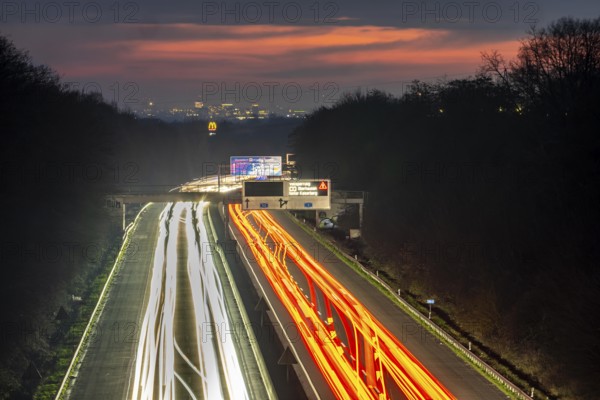 Evening traffic on the A52 motorway, between Düsseldorf and Essen, in front of the Breitscheid motorway junction, partly slow rush hour traffic, looking south, North Rhine-Westphalia, Germany