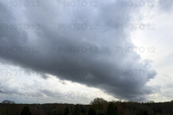 Large grey cloud roller Stratocumulus cluster layer cloud during high winter conditions, international