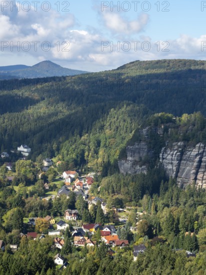 Mountain landscape with forest, rocks and village, view of Oybin, Zittau Mountains, Saxony, Germany