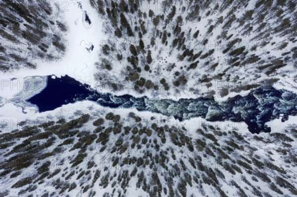 Aerial view over rapids in the river Kitkajoki in winter, Oulanka National Park, Northern Ostrobothnia / Norra Österbotten, Finland