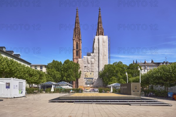St. Boniface Catholic Church, scaffolding, renovation, concrete paving square, trees, general architecture, public trash can, blue sky, cirrus clouds, Luisenplatz, Luisenstraße, Wiesbaden, state capital, district-free city, Hesse, Germany