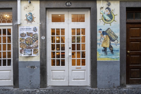 Colourfully painted doors on Santa Maria Street in the old town, Funchal, Madeira, Portugal