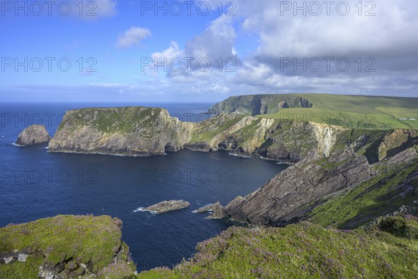 View of blue sea and cliffs with rock gate from Portacloy Loop Cliff Walk, Muingnabo, County Mayo, Ireland