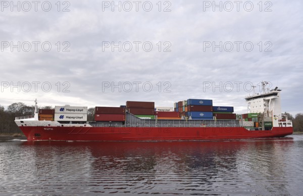 Container ship, RUTH sails in the evening in the Kiel Canal, NOK, Kiel Canal, Kiel Canal, Schleswig-Holstein, Germany