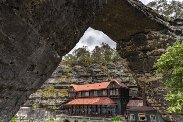 The Prebischtor rock arch and the Hotel Falkennest or Sokolí hnízdo in the Bohemian Switzerland National Park near Hrensko, Czech Republic