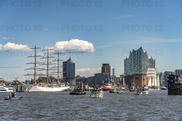 Incoming parade of ships and sailboats at Hafengeburtstag Hamburg 2025 in front of the Elbe Philharmonic Hall in the Hanseatic City of Hamburg, Germany