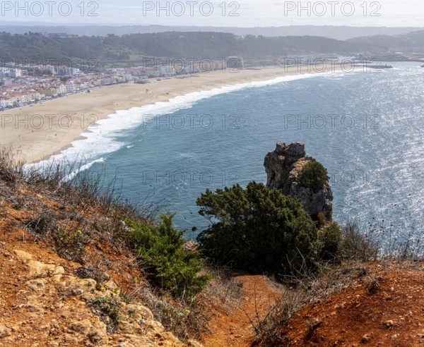 View of the extensive beach from the platform at Farol de Nazare, Portugal