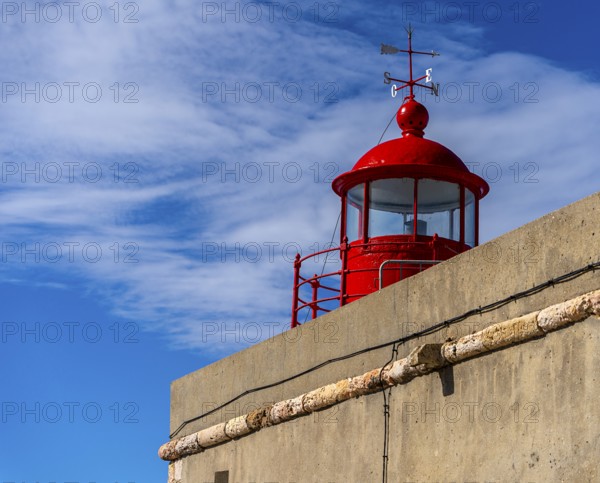 The Farol de Nazare lighthouse, an annual meeting point in autumn to watch the big waves on the North Beach, Nazaré, Portugal