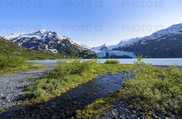 On the shores of Portage Lake, Snowy Mountains and Glaciers Portage Glacier, Chugach National Forest, Alaska, USA