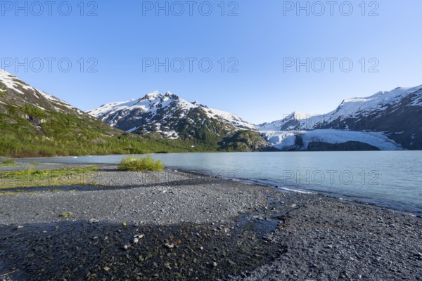 Snowy mountains and glaciers Portage Glacier on Portage Lake glacial lake, Chugach National Forest, Alaska, USA