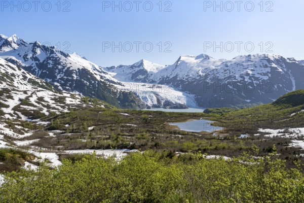 View from Portage Pass of Divide Lake, snowy mountain peaks and glaciers Portage Glacier, Portage Pass Trail, near Whittier, Alaska, USA