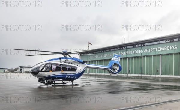 Helicopter from the Baden-Württemberg Police team in front of the hangar at the airport. Airbus Helicopters H145. Stuttgart, Baden-Württemberg, Germany