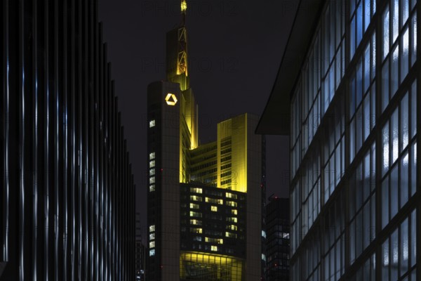 A yellow heart glows on the façade of the Commerzbank Tower in Frankfurt am Main at Christmas time in the evening, Frankfurt am Main, Hesse, Germany