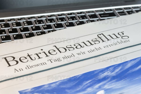 Company outing Symbolic picture: Symbolic newspaper with the headline COMPANY OUTING — WE ARE NOT AVAILABLE ON THIS DAY