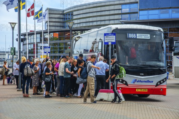 Traffic terminal at the port of Ystad, Skåne County, Sweden. Travelers from Bornholm board a bus bound for Copenhagen, Denmark