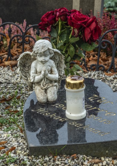Gravestone with angel and candle in Ystad, Skåne County, Sweden, Scandinavia