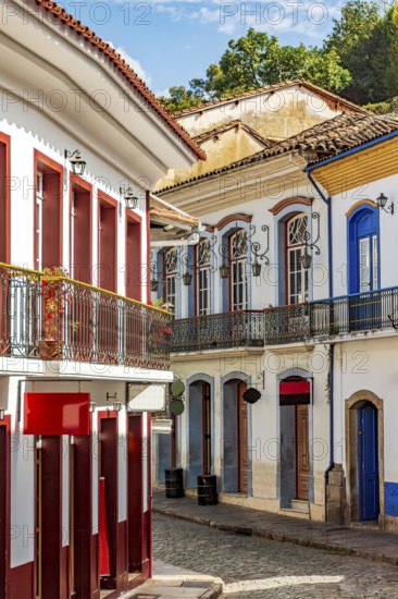 Old mansions and cobblestone paving on the historic streets of Ouro Preto, Ouro Preto, Minas Gerais, Brazil