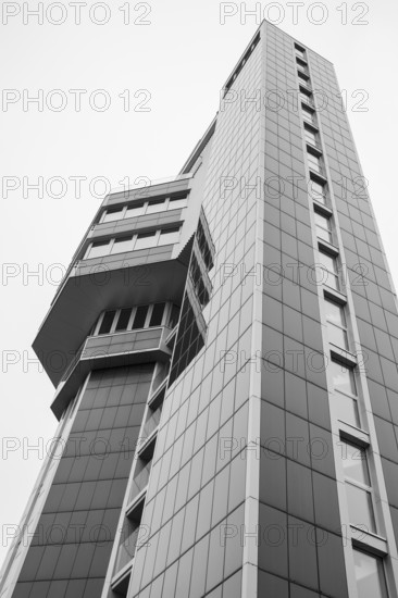 Modern architecture, geometric lines photographed in black and white, former water tower of the Radolfzell dairy plant, converted into the Hotel Aqua-Turm since 2017. The world's first zero-energy passive high-rise building, the entire façade consists of around 1000 photovoltaic modules and uses solar thermal wind power and hydrothermal energy to produce more energy than it consumes, Konstanz district, Baden-Württemberg, Germany