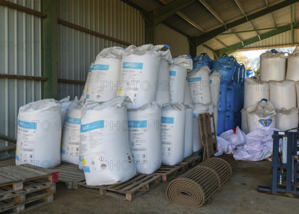 MYPREMIAN ammonium nitrate LAR nitrogen fertiliser bags stored in farm barn, Suffolk, England, UK