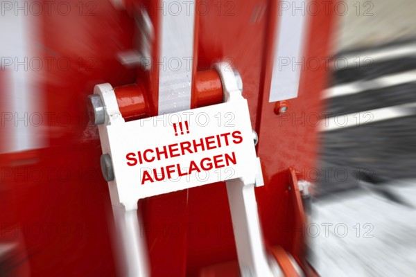 (Photo montage) Close-up of an anti-terrorist lock at a Christmas market with added text SAFETY REQUIREMENTS