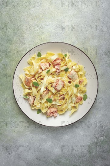 Tagliatelle pasta, in cream sauce with salmon, homemade, no people