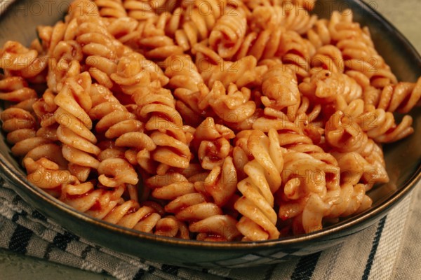 Fusilli pasta dish, made with tomato sauce, homemade, no people