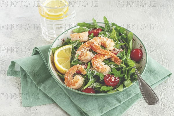 Shrimp salad with arugula and cherry tomatoes, with parmesan cheese, healthy food