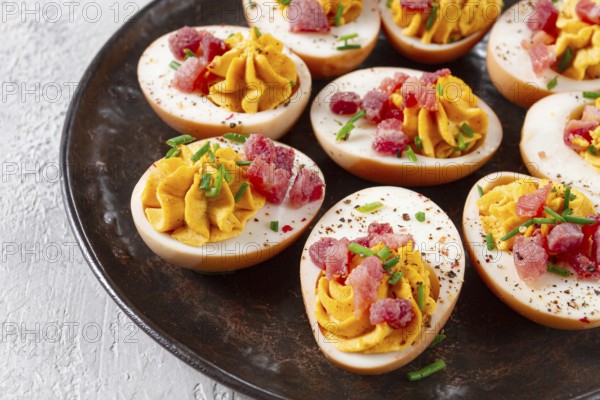 Spicy, stuffed ramen eggs, with bacon and green onions, homemade, no people