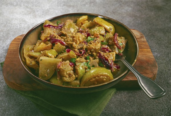 Fried green tomatoes, with onions and spices, green tomato appetizer, Georgian cuisine, homemade, no people