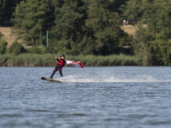 Boy or girl with wakeboard, sporty on the water, active water sports, wake park