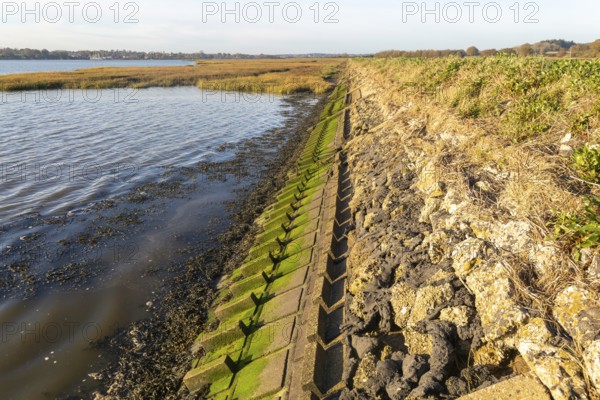 River Deben earthwork bank flood defence wall, Sutton, Suffolk, England, UK