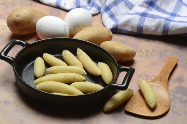 Raw Schupfnudeln in pan, type of pasta, Germany