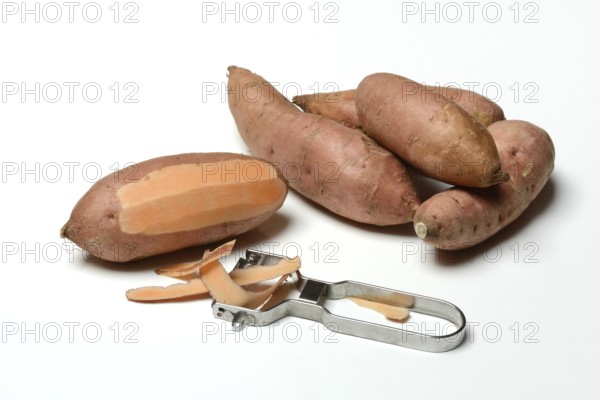Sweet potato with potato peeler, Ipomoea batatas