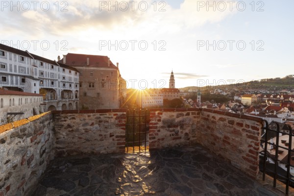 Spring morning sunrise with castle view over the rooftops of Krumlov in southern Bohemia, Czech Republic