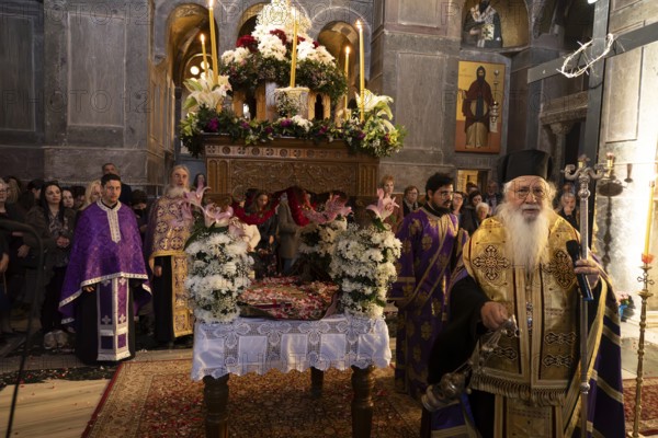 Orthodox priests at Epitaphios at Mass on Good Friday in the Catholicon of the Hosios Luke Monastery, UNESCO World Heritage Site in Steiri, Greece